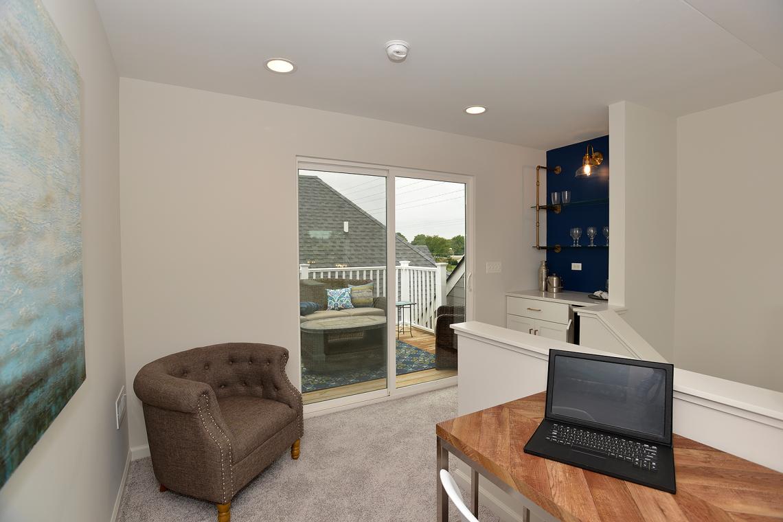 This away room opens to a roof top terrace, a custom feature by Airhart Construction
