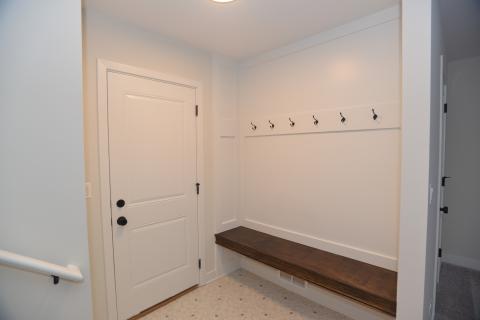 Mudroom boot bench and coat hooks