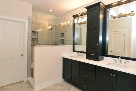 McAlister - owners suite bathroom with vanity top mounted cabinet