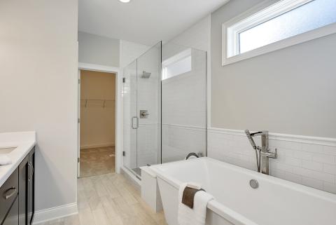 Harrison - owners suite bathroom with free standing tub and full glass shower