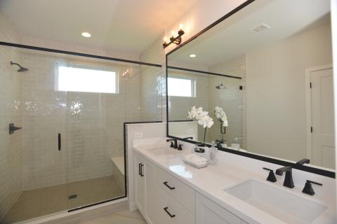 St. James - owners suite bathroom with black trim on mirror and shower