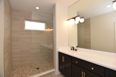 St. James - owners suite bathroom with pebble shower floor