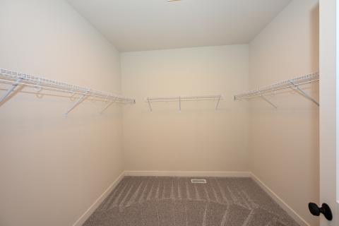 Walk-in closet for the Oakfield Ranch home with Nantucket elevation and three car garage for sale in Saint Charles Illinois 
