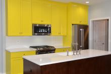 Rosehill Ranch kitchen with yellow cabinets by Airhart Construction